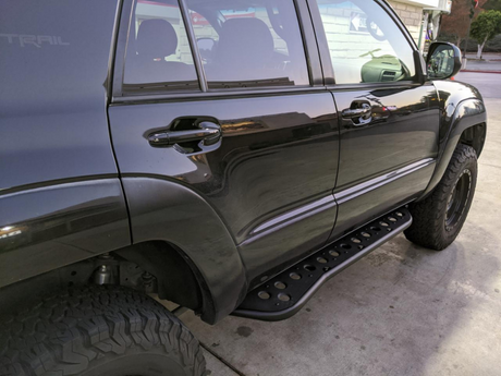 Rear passenger side view of Toyota 4Runner with Step Edition bolt on rock sliders - Cali Raised LED