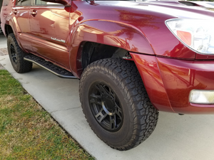 Front passenger side view of Toyota 4Runner with Step Edition bolt on rock sliders - Cali Raised LED