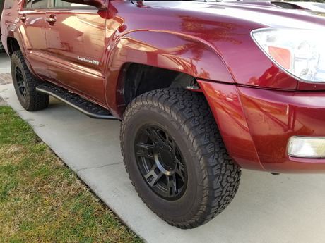 Front passenger side view of Toyota 4Runner with Step Edition bolt on rock sliders - Cali Raised LED